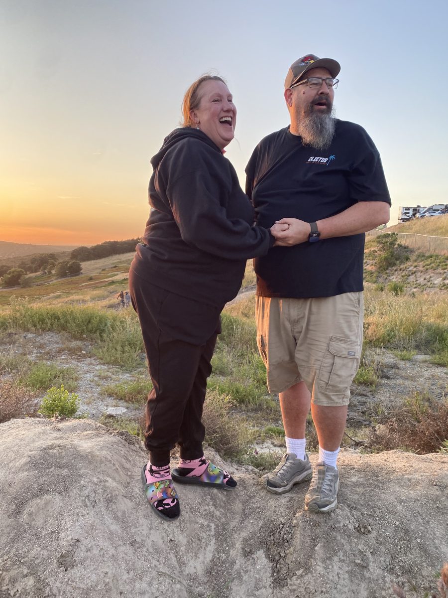 Jen laughing and holding hands with Sean just after the proposal